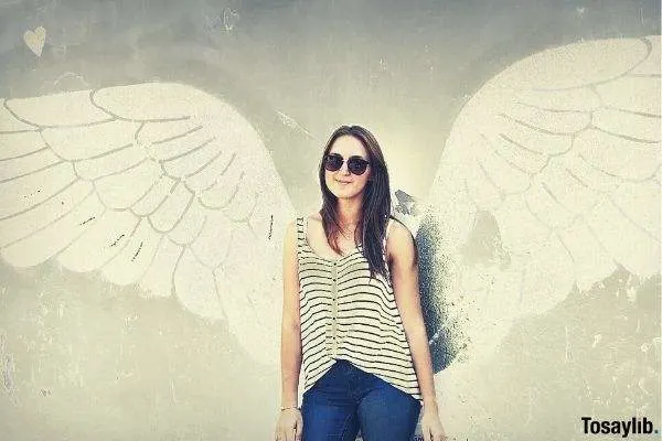 girl photo with wings on the wall