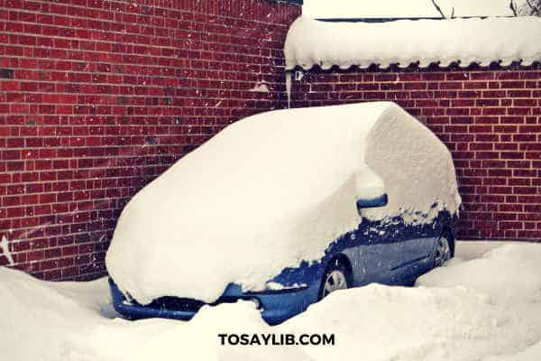 heavy snowfall on a car