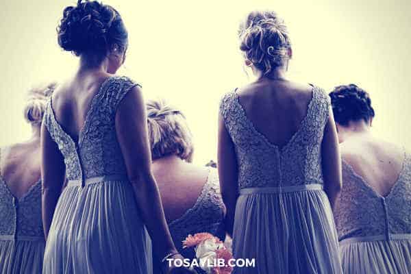 bridesmaid in purple gowns shot from their back