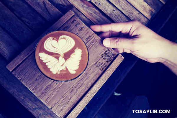 cappuccino on a wooden tray
