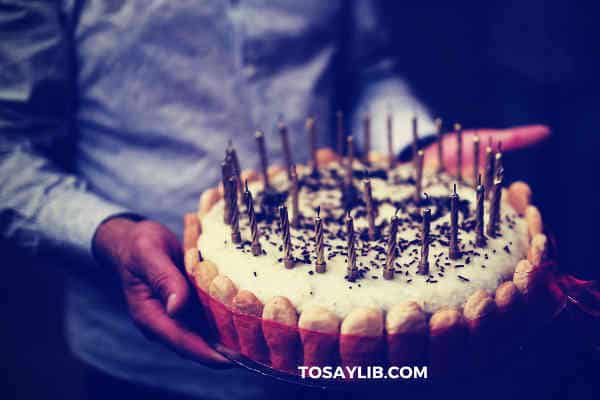 birthday cake lady fingers with a lot of candles