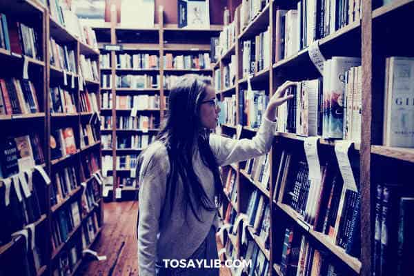 girl searching book in liberary