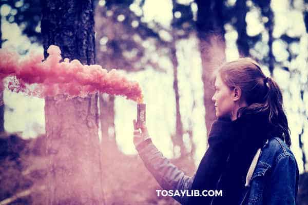 girl holding pink bomb