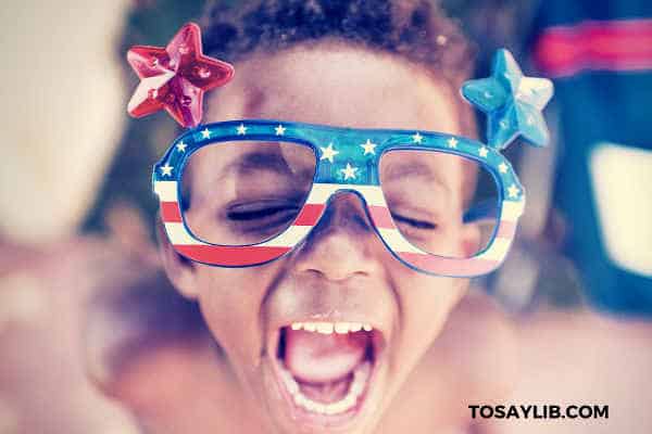 kid wearing amercian flag glasses