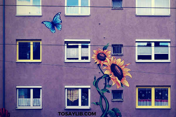 butterful sunflower paintings on a building