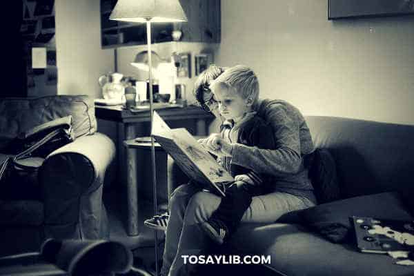 mother teaching son how to read