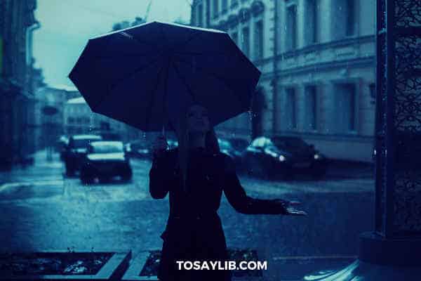 cloudy rainny day woman holding umbrella