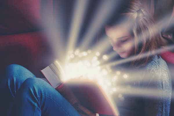 girl-reading-fairy-tales-book-shining