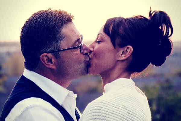 husband-kissing-wife-celebrate-wedding-anniversary
