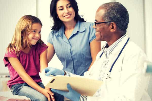 doctor-illness-report-kid-parent-smiling