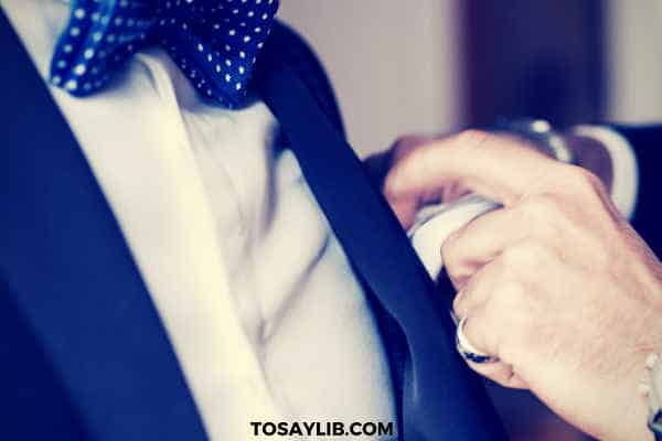 best man helping groom napkin