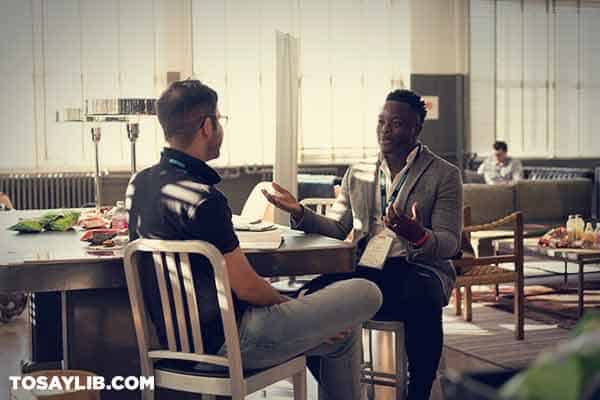 07 Photo of two men having a conversation