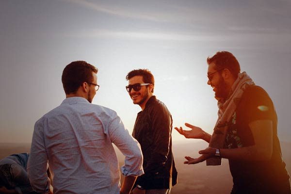 10-Featured-Photo-of-three-men-standing-and-laughing-together