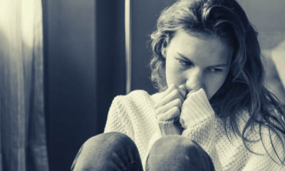 feature-grayscale-photo-of-woman-covering-her-mouth-using-her-hands