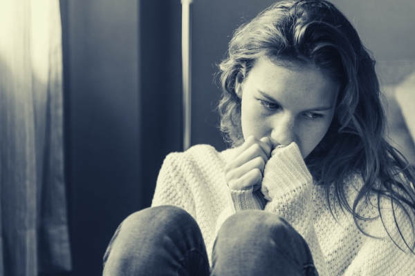 feature-grayscale-photo-of-woman-covering-her-mouth-using-her-hands