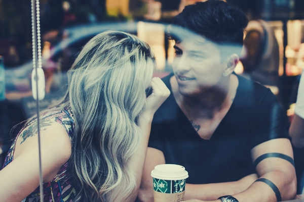 feature-photo-of-couple-inside-the-coffee-shop-looking-at-each-other