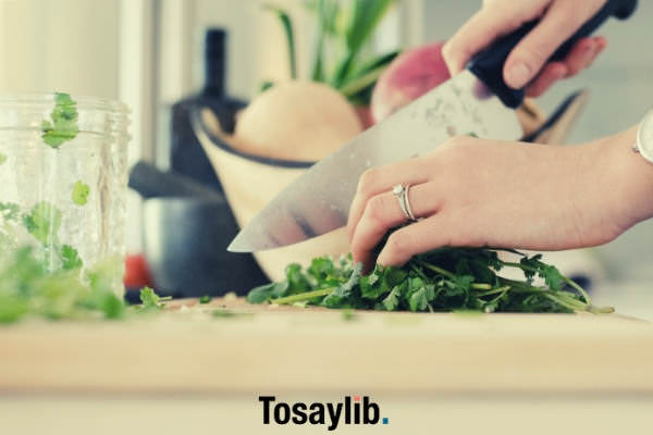 cutting cilantro leaves knife hand