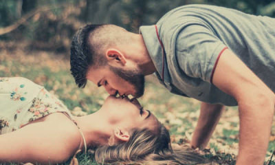 19-feature-photo-of-a-man-kissing-a-woman-lying-on-the-ground