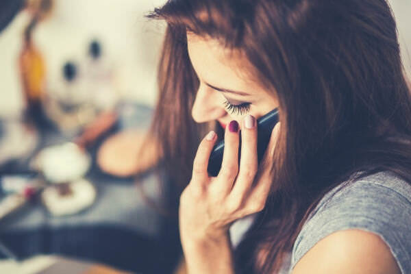 feature-closeup-portrait-of-young-lady-talking-on-mobile-phone