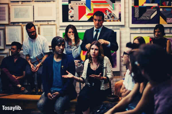 group of people in a meeting talking