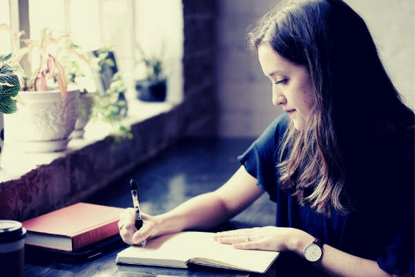 feature-Girl-sitting-while-journaling