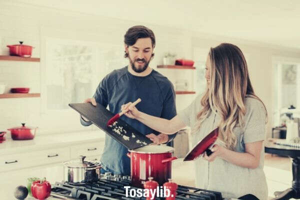 couple cooking kitchen
