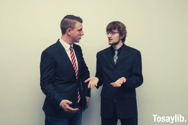 men in office uniform arguing