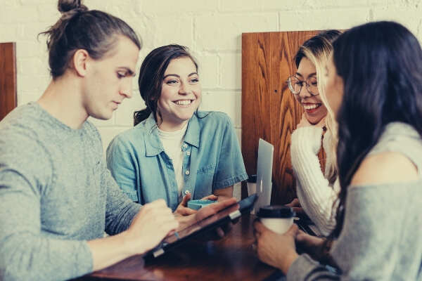 group of friends people talking over coffee