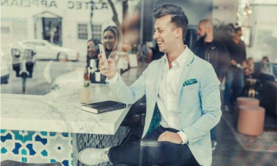feature-guy-using-cellphone-smiling