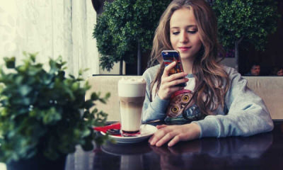 feature-portrait-of-woman-photographing-with-smart-phone