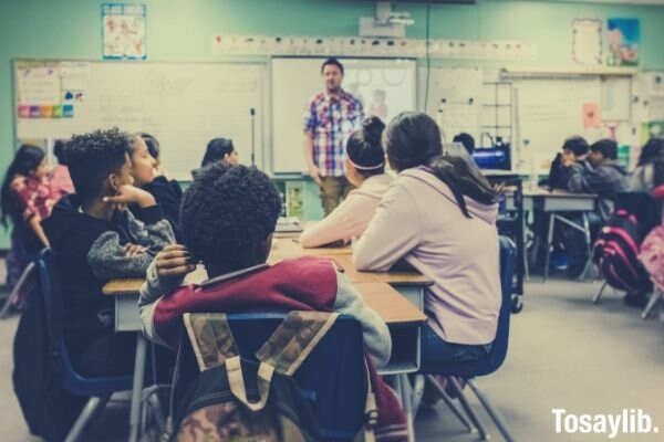 classroom students listening to their teacher 1