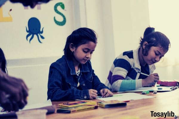 two girls doing school works