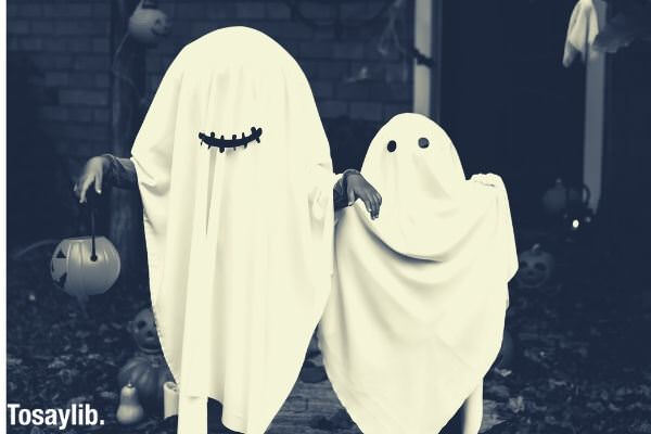 two people dressed as ghost