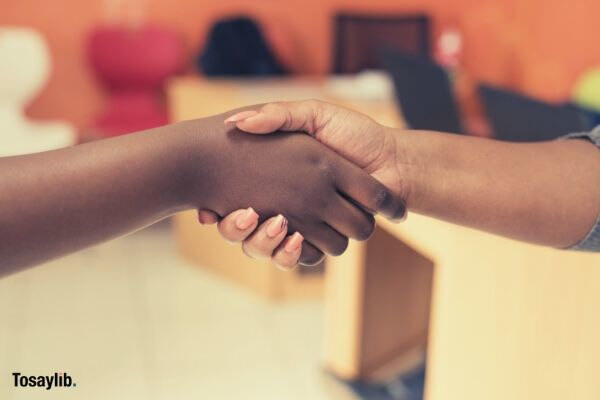 two people shaking hands