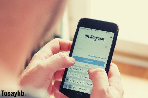 man using smartphone logging in instagram