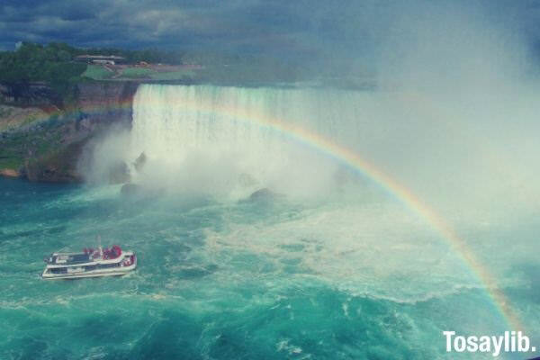 ship falls body of water rainbow