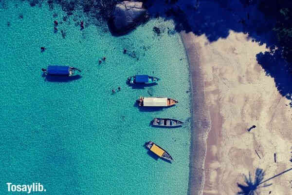 outdoor sand beach boat blue sea