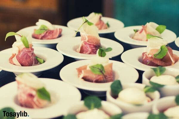 Delcious salmon served as finger food on white plate