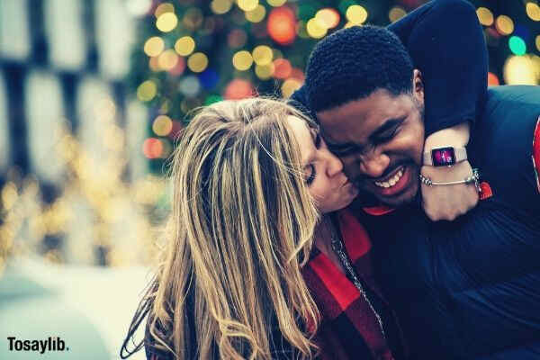 lovers smiling woman kiss to black man