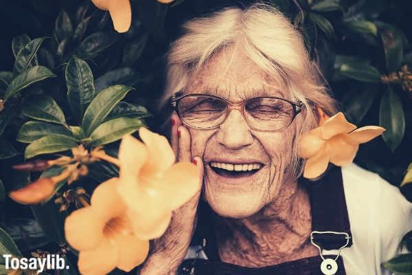 woman standing near yellow petaled flower