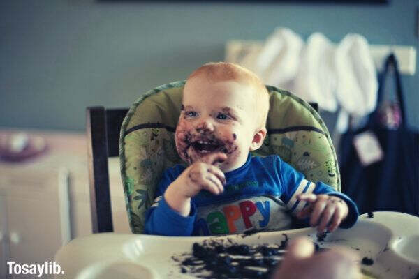 toddler boy enjoying dinner