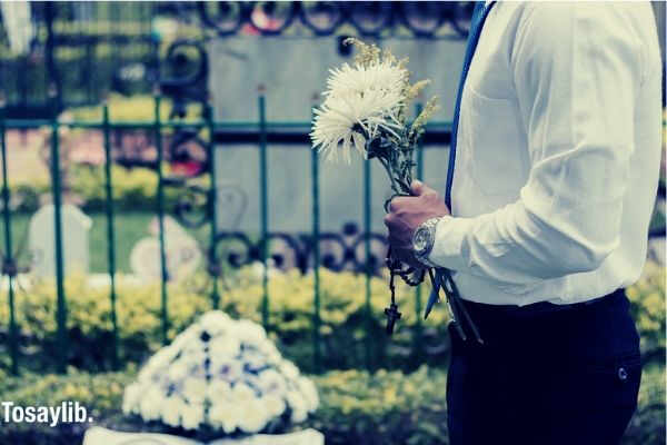 funeral adios bye memory death man holding flowers