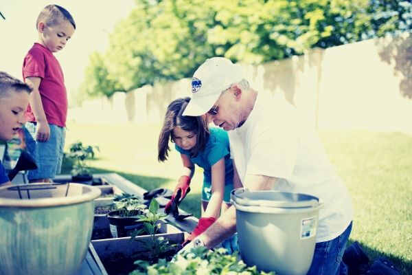 feature-13-kids-planting-a-garden-with-grandpa