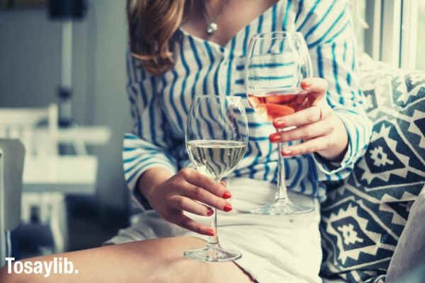 04 woman holding two glasses of wine