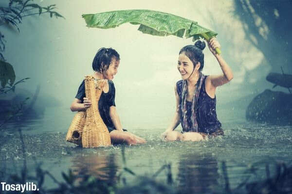 woman young rain pond cambodia