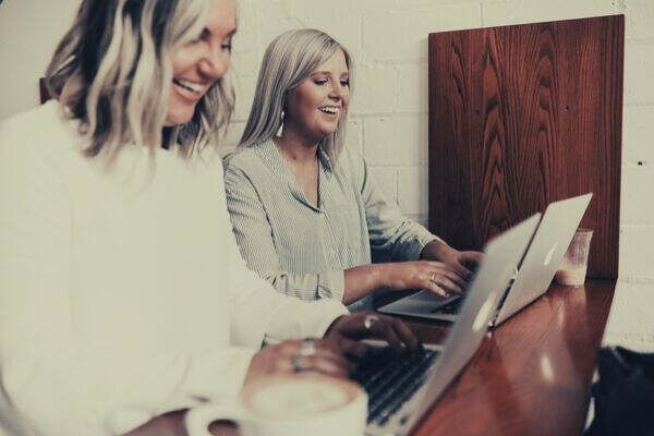 two-women-colleagues-laptop
