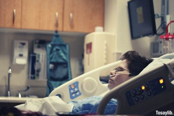 sick boy oxygen hospital bed