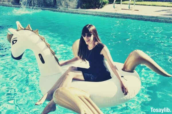 inflatable unicorn pool party woman