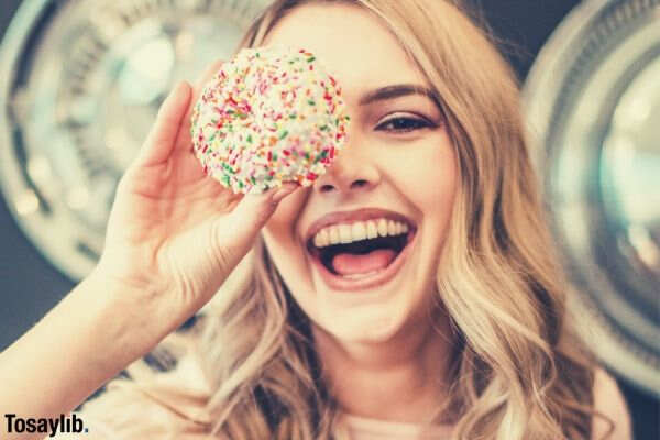 girl holding cupcake