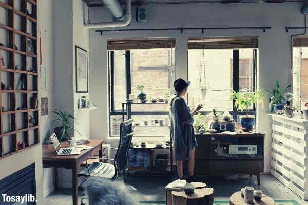 woman standing near brown wooden cabinet